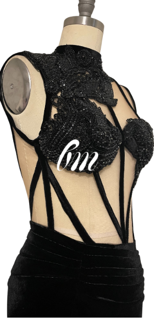 Black lace top on a mannequin with '6m' text